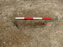 Thumbnail of Area A, S facing section of posthole [3109], 0.4M scale, view from S