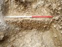 Thumbnail of Area A, sondage trough base of water hole & pit [3099], 1M scale, view from ENE