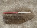 Thumbnail of Area A, mid-ex view of S facing section of grave [3132], 1M scale, view from S