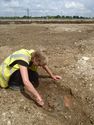 Thumbnail of Area A, working view of pottery in pit [3331]