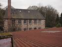 Thumbnail of External shot of corrugated metal roof, showing Providence Mill beyond