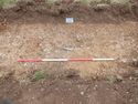 Thumbnail of East facing pre-excavation shot of possible pit [006] (2m scale)