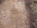 Thumbnail of North-east facing pre-excavation shot of burial 1 (0.2m scale)