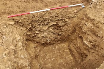 Oblique shot of south facing section of enclosure ditch [1015]. From Archaeological Recording at West of Culworth, Northamptonshire, England.