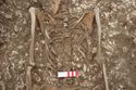 Thumbnail of Photo 17396 Skeleton 605276 belt fragments
