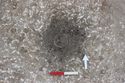 Thumbnail of Photo 3166 N facing section of pre-excavated cremation [605179] no board.