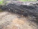 Thumbnail of Oblique shot of SE facing section in trench 282, N direction, 1m scale
