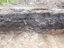 Thumbnail of West facing rep section of trench 284, E direction, 1m scale
