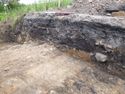 Thumbnail of Oblique shot of West facing section of trench 284, NE direction, 1m scale