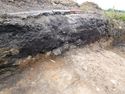 Thumbnail of Oblique shot of East facing section of trench 284, NW direction, 1m scale