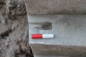 Thumbnail of Trench 1, sockets within stone steps of plunge bath perhaps used to house hand rail. View S, 0.1m scale