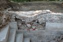 Thumbnail of Trench 1, missing section of plunge bath wall {109} causing subsidence in exterior wall {108} of Bath House. View WNW, 0.5m scale