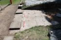 Thumbnail of Overview of Trench 1 showing entrance into Bath House (surface {117} and column bases {121} and {122}), view SSW, 2m scale