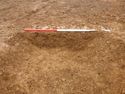 Thumbnail of Ditch [1011]. South West facing section of corner slot-post, facing North East. From archaeological recording and construction integrated recording at Thorpe Mandeville, Northamptonshire, England.