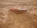 Thumbnail of Ditch [1011]. South East facing section of corner slot-post, facing North West. From archaeological recording and construction integrated recording at Thorpe Mandeville, Northamptonshire, England.