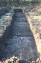 Thumbnail of An overview photograph of trench 1, facing west, scale 2x1m