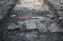 Thumbnail of A focused photograph of feature [1003] post-medieval wall, facing north-west, scale 1x1m 1x1m (1 of 2)