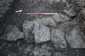 Thumbnail of A focused photograph of feature [1003] post-medieval wall, facing north-west, scale 1x1m 1x1m (2 of 2)