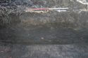 Thumbnail of A photograph showing the west facing representative section of trench 9, facing east, scale 1x1m (1 of 2)