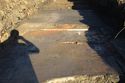 Thumbnail of A focused photograph of feature [905] brick surface, facing north, scale 1x1m