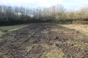 Thumbnail of A photograph of the site post-excavation and backfilling, facing west