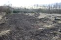 Thumbnail of A photograph of the site post-excavation and backfilling, facing south