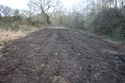 Thumbnail of A photograph of the site post-excavation and backfilling, facing east