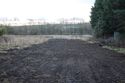 Thumbnail of A photograph of the site post-excavation and backfilling, facing south