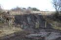 Thumbnail of A photograph post-excavation showing damage to the fence, facing east