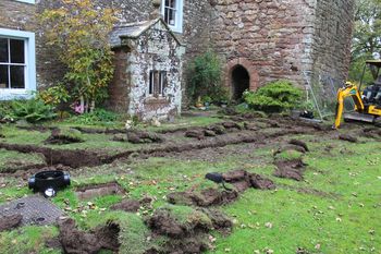 Working shot of trenches excavation, facing North East