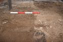 Thumbnail of View to east. Watching brief in Turl Street Gatehouse. Cut for iron pipe, 1x0.40m scale.