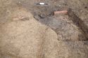 Thumbnail of 110490_to_110498_Mitigation_Image_1288, Set Piece Excavation area 7, working shot/pottery in-situ in ditch 7356, from south.