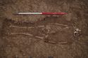 Thumbnail of 110494.01_Report_Plate_55, Hornsea Offshore Wind Farm Project One, Post-excavation Assessment and Updated Project Design, Plate 55 (also Plate 2.33 in the 221790 publication - The Archaeology of the Hornsea Project One Offshore Windfarm Cable Route, Wessex Archaeology Monograph 41, 2022): SPE7 (Set Piece Excavation area 7) grave 7392 containing inhumation 7393, from north-east.