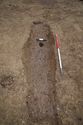 Thumbnail of 110494.01_Report_Plate_57, Hornsea Offshore Wind Farm Project One, Post-excavation Assessment and Updated Project Design, Plate 57 (also Plate 2.35 in the 221790 publication - The Archaeology of the Hornsea Project One Offshore Windfarm Cable Route, Wessex Archaeology Monograph 41, 2022): SPE7 (Set Piece Excavation area 7) grave-shaped pit 7301, from south-east.