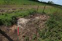 Thumbnail of 110497_HBR_Image_016, Historic Building Recording Report 110497.03 Plate 16, view of red-brick foundations of south-western corner and fragmented concrete base of B1.