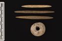 Thumbnail of 221790_Publication_Plate_6.04, The Archaeology of the Hornsea Project One Offshore Windfarm Cable Route, Wessex Archaeology Monograph 41, 2022, Plate 6.4: Romano-British spindlewhorl object 71 and Anglo-Saxon pin beater objects 107, 114  and 120. Site area of pin beater related contexts is TWB4. (See metadata file for full description)