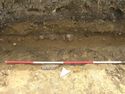 Thumbnail of section of RR1 stone fabric and agger, and buried soil, against L.O.E