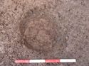 Thumbnail of Shot of pit [105] - partially excavated; pot visible