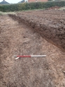 Thumbnail of Ditch exposed in evaluation. Not investigated with agreement of DCC, view from the northeast. 1m scale.