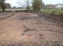 Thumbnail of View of cleaned site, after excavation of the sample pits, two 1m scales; view from the east