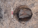 Thumbnail of Base of furnace [F12] post-excavation. 0.3m scale; view from the east.
