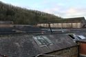 Thumbnail of View of the roofline of the former mule spinning shed and parapet of the western elevation.