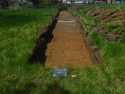 Thumbnail of Pre-excavation shot of trench 1, facing west (1m x 2m scale) taken during an archaeological evaluation at Milken Lane, Ashover, Derbyshire