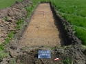 Thumbnail of Pre-excavation shot of trench 2, facing South-East, (1m x 2m scale) taken during archaeological evaluations at Milken Lane, Ashover, Derbyshire