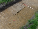 Thumbnail of Photograph depicting footpath [203] uncovered during archaeological evaluations at Milken Lane, Ashover, Derbyshire (1m scale)