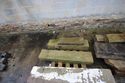 Thumbnail of Detail of some remaining blocks of masonry stored in the yard, facing south west. These are likely from the now demolished wall and gable to the south east of the site.