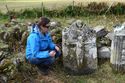 Thumbnail of Cara Jones (ACCORD, Archaeology Scotland) examining the crucifixion scene on one of the headstones recorded by the Ardnamurchan Community Archaeology group with ACCORD. <br/> (Ardnam_Production_Images_09.jpg)