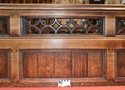 Thumbnail of Detail front of decorated pew above seat level looking west