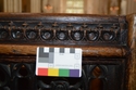 Thumbnail of Detail upper carving on decorated pew looking east