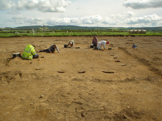 Photograph: Excavation of Building 3, with crew and volunteers
